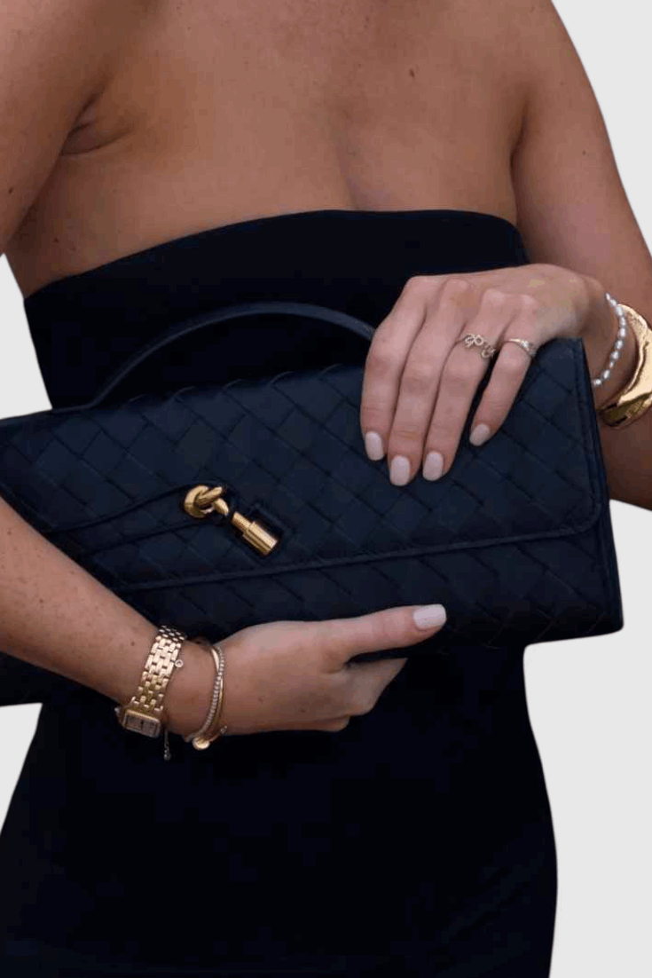 Melanie | Cartera de mano con lazo dorado
